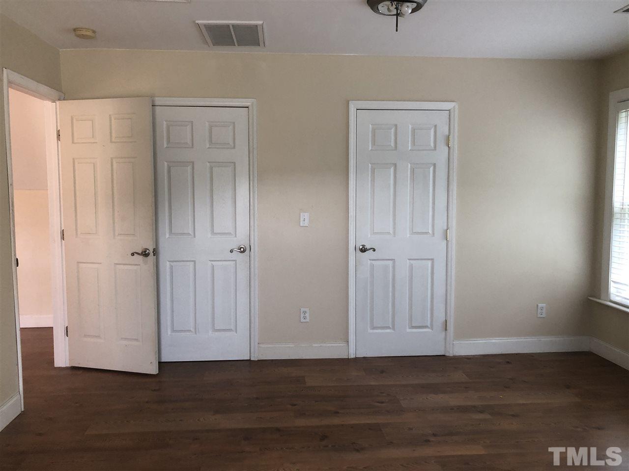 330-j B J B Leonard Road Castalia, NC 27816 - Photo 8 of 9 a view of an empty room with wooden floor and a window