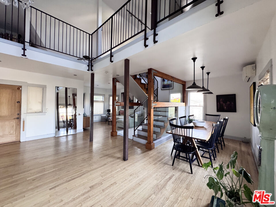 814 East Edgeware Road Los Angeles, CA 90026 - Photo 9 of 33 a dining room with furniture entryway and wooden floor