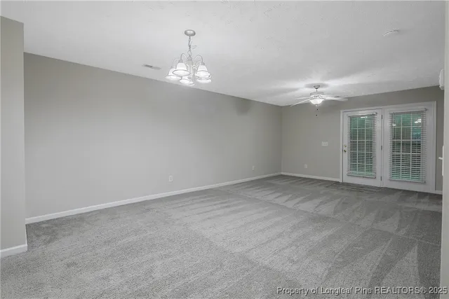 a view of empty room with windows