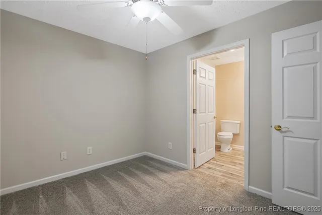 an empty room with a bathroom