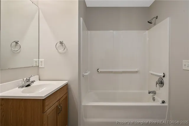 a bathroom with a bath tub and a sink