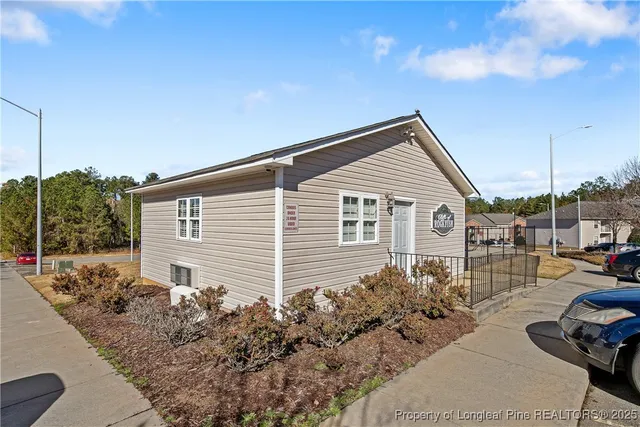 a house view with a backyard space