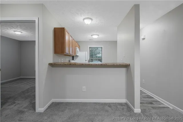 a view of a kitchen cabinets and a counter place