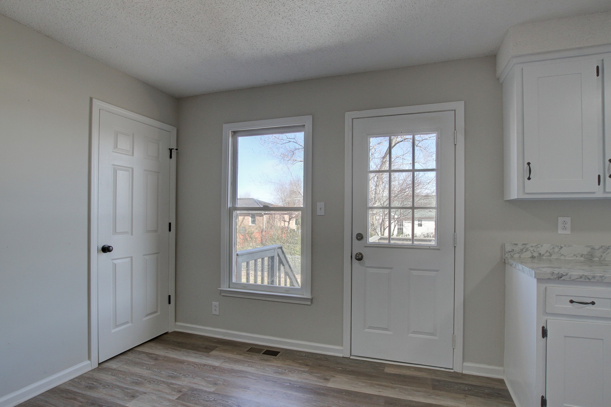 1007 McClardy Road Clarksville, TN 37042 - Photo 11 of 34 a view of an empty room with wooden floor and a window