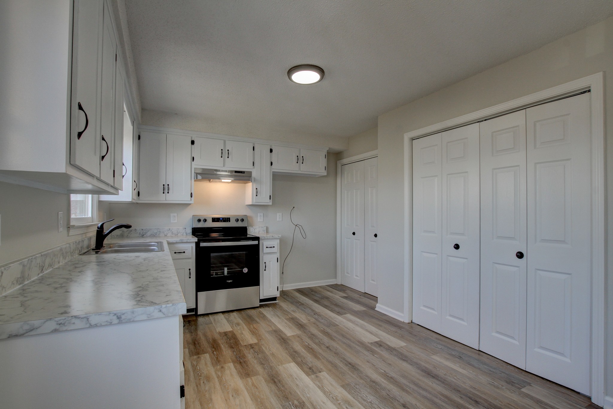 1007 McClardy Road Clarksville, TN 37042 - Photo 12 of 34 a kitchen with a stove and a sink