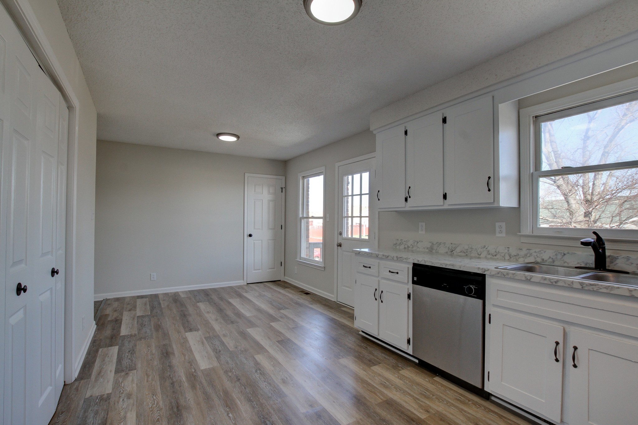 1007 McClardy Road Clarksville, TN 37042 - Photo 14 of 34 a kitchen with granite countertop white cabinets and white appliances