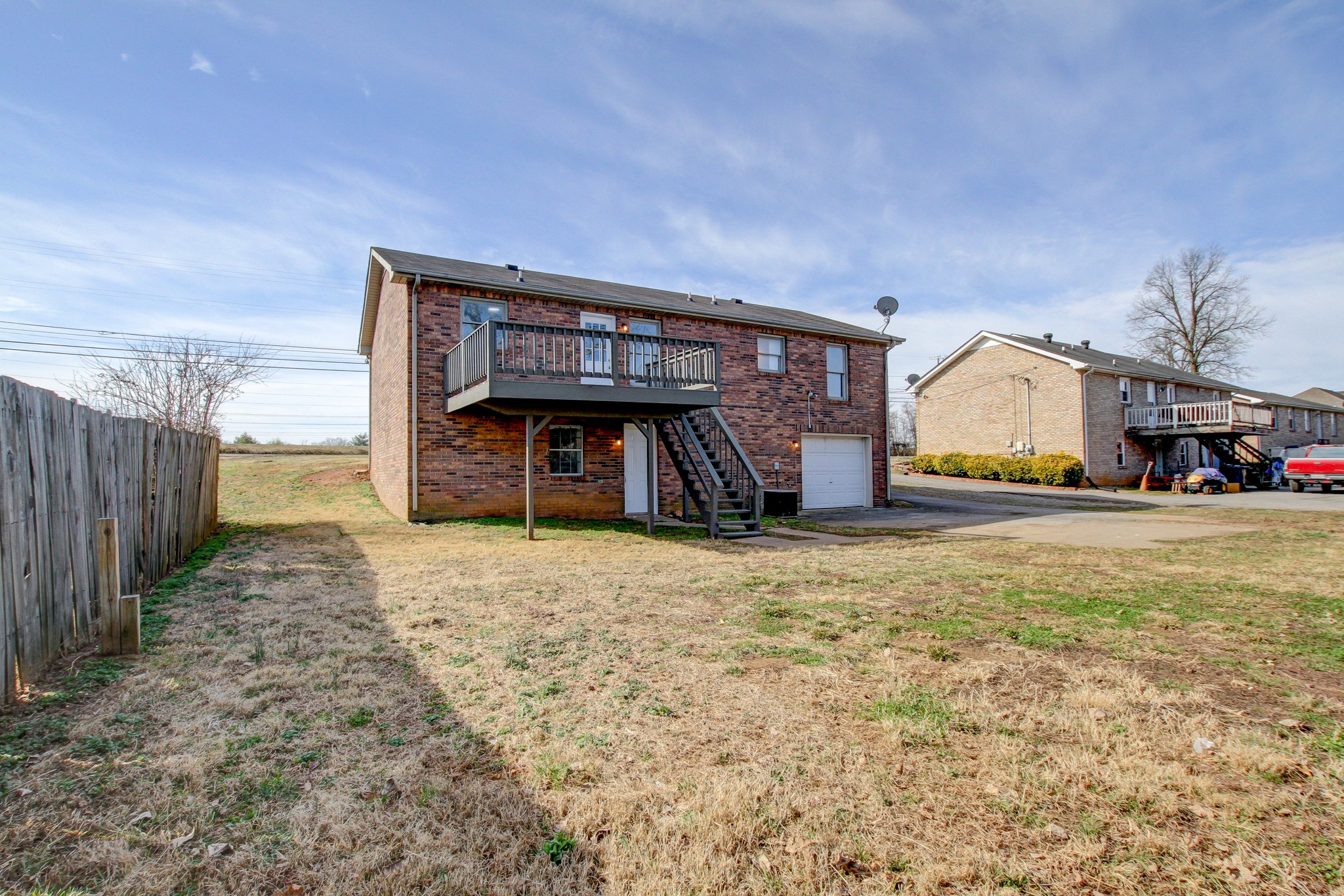1007 McClardy Road Clarksville, TN 37042 - Photo 28 of 34 a front view of a house with a yard and garage