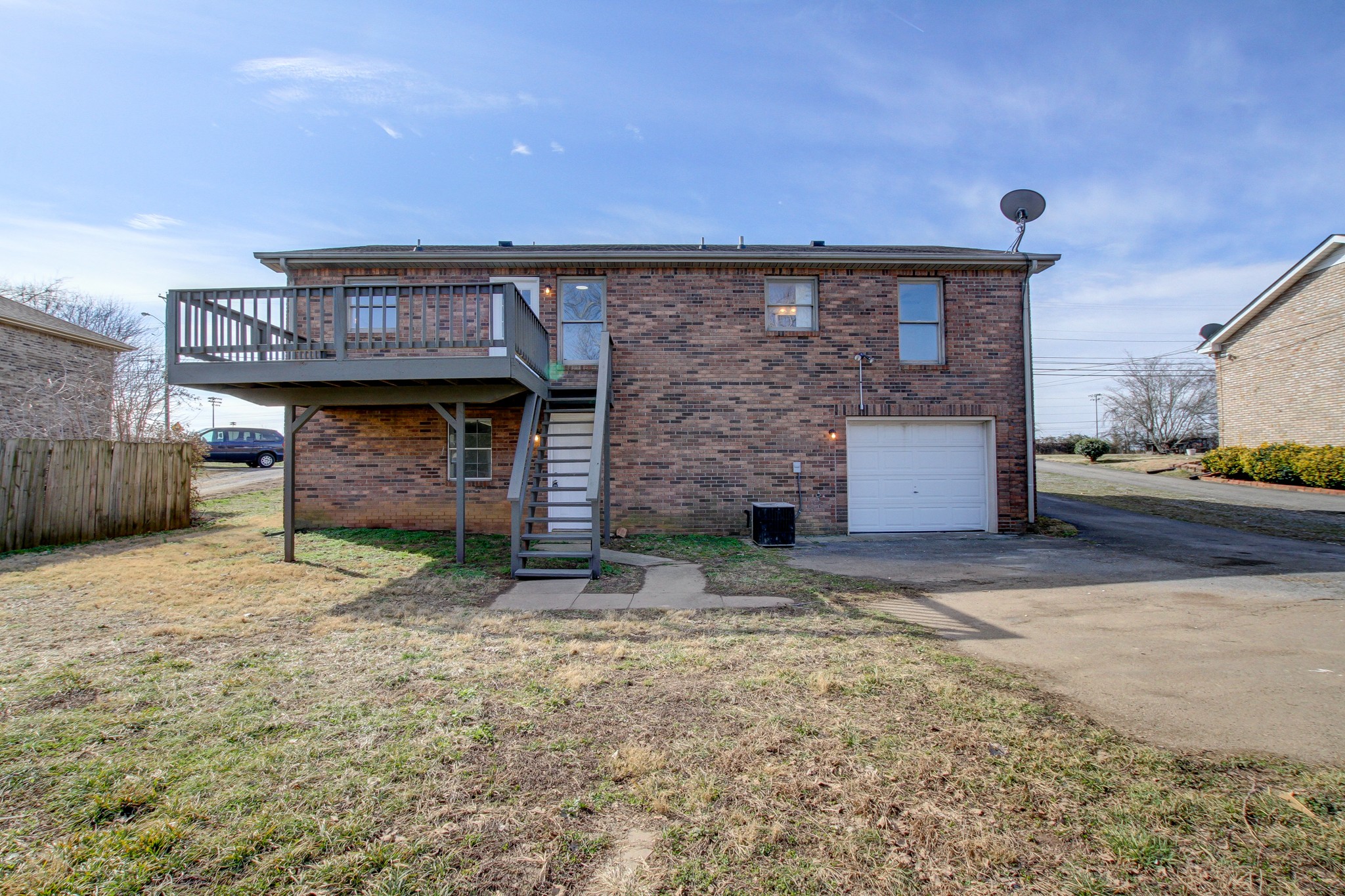 1007 McClardy Road Clarksville, TN 37042 - Photo 29 of 34 a backyard of a house with barbeque oven and parked