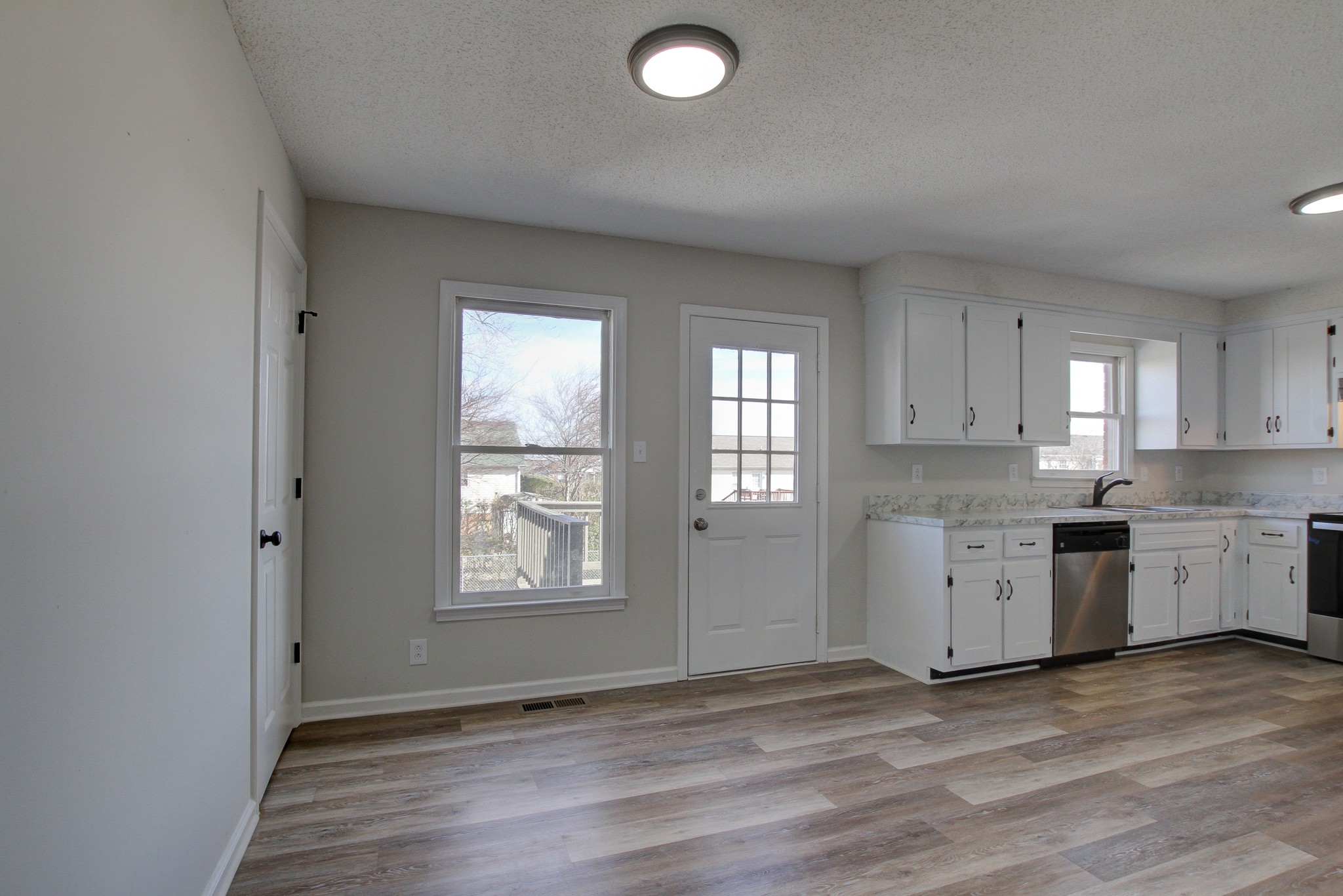 1007 McClardy Road Clarksville, TN 37042 - Photo 8 of 34 a view of a kitchen with wooden floor and electronic appliances