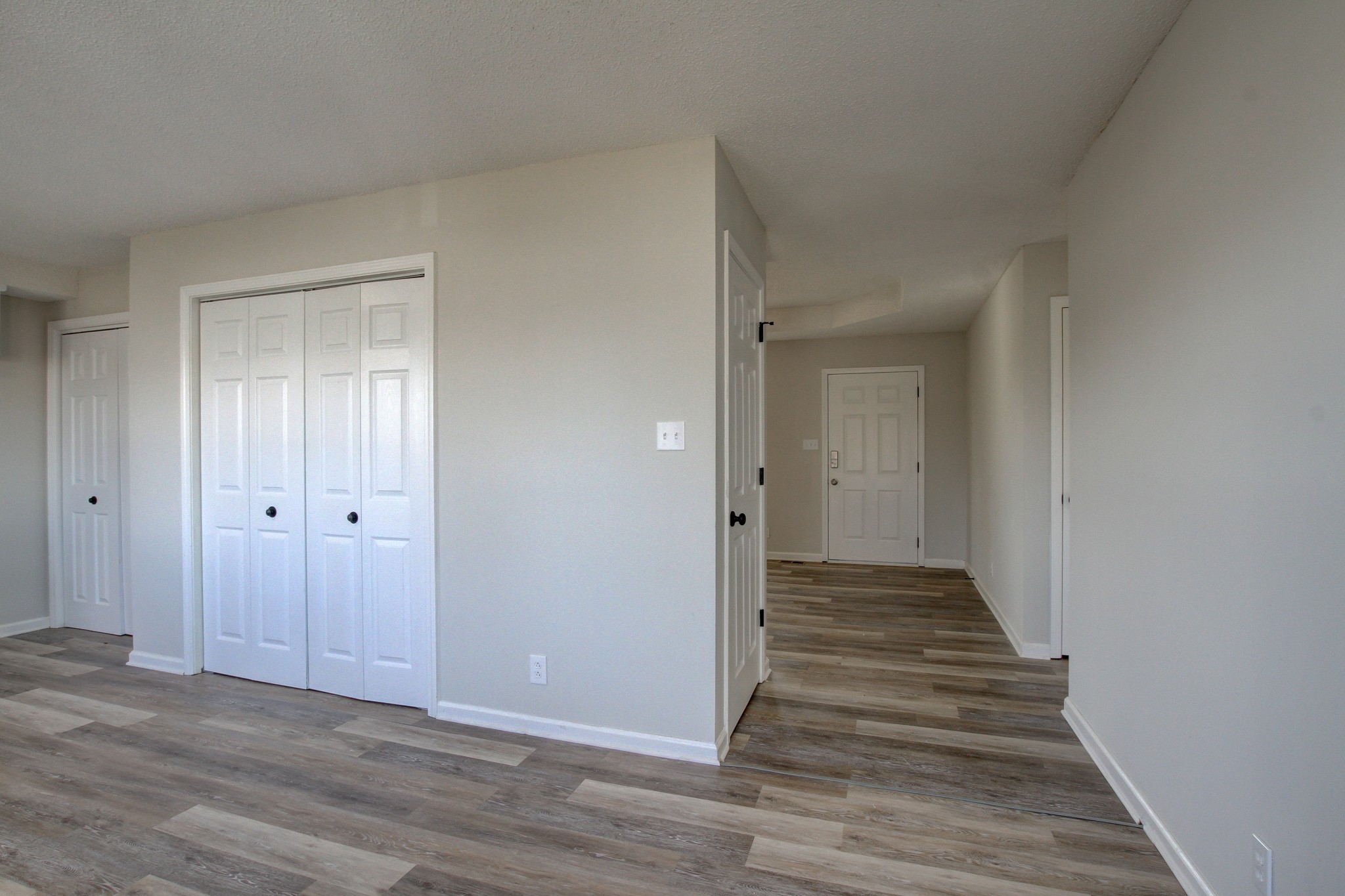 1007 McClardy Road Clarksville, TN 37042 - Photo 9 of 34 a view of a hallway with wooden floor