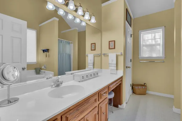 a bathroom with a sink double vanity and a mirror