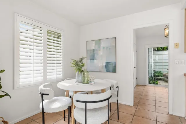 a workspace with furniture and a potted plant