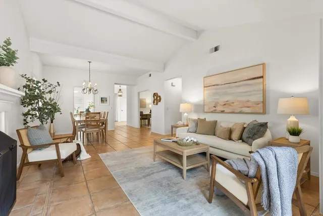 a view of a dining room with furniture and window