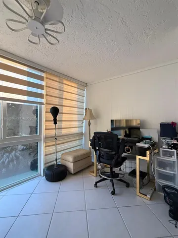 a view of a workspace with furniture