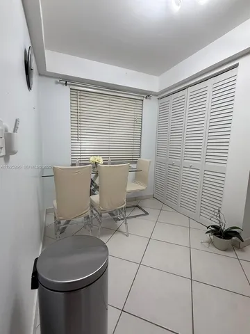 a view of a room with gym equipment and window