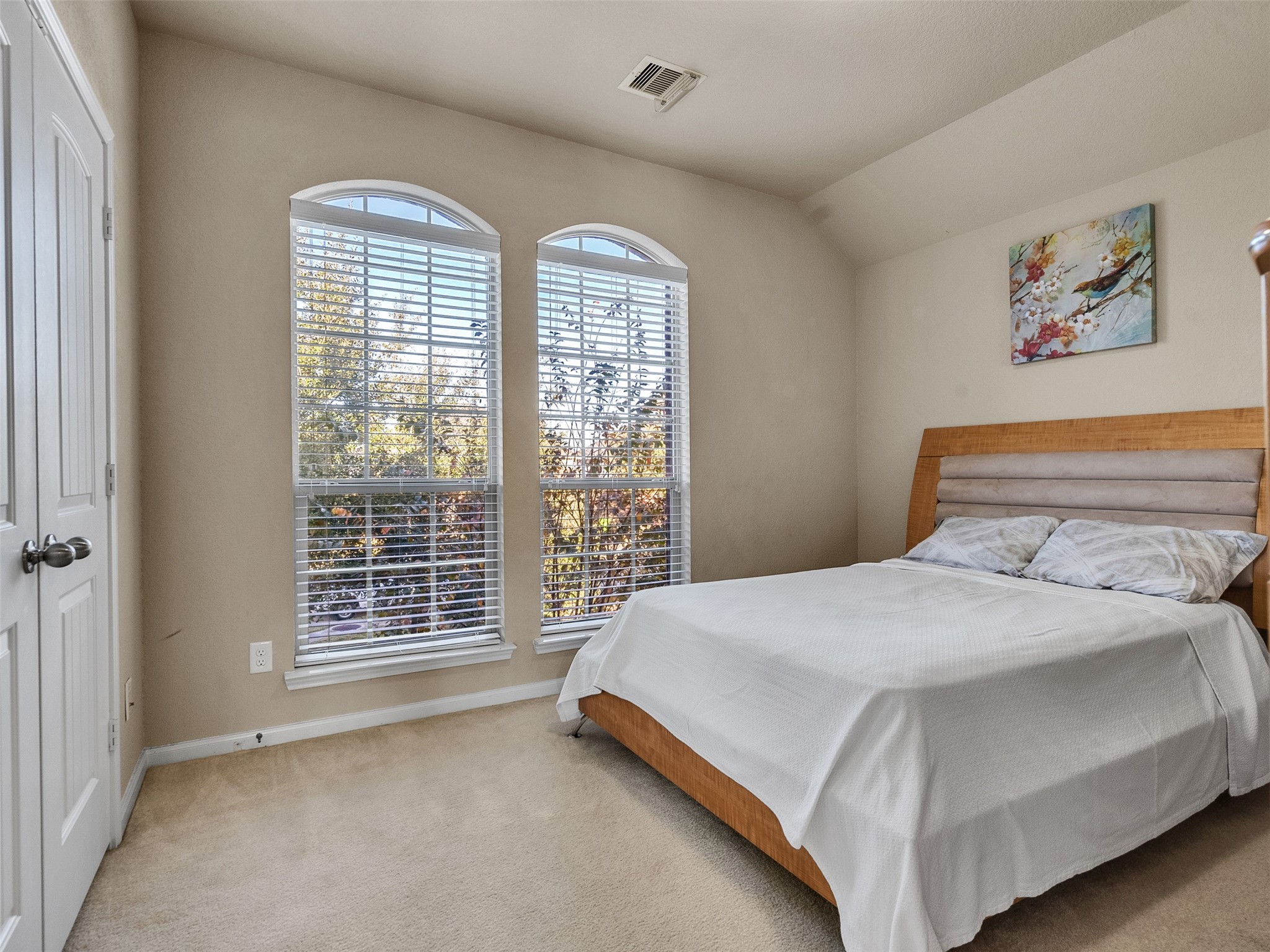 522 Summer Mist Lane Rosenberg, TX 77469 - Photo 20 of 36 Arched window goals! There is nothing like waking up in a room filled with natural light. This guest bedroom is the perfect mix of cozy and modern.