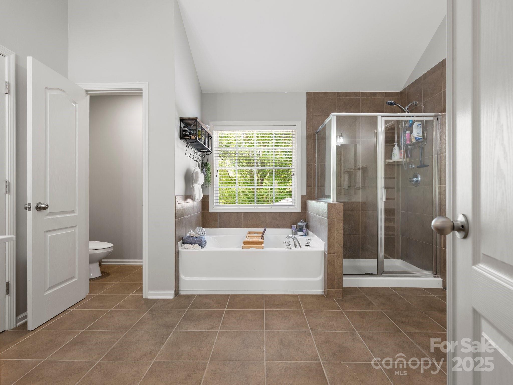 2002 Potomac Road Indian Trail, NC 28079 - Photo 26 of 43 a spacious bathroom with a tub and shower