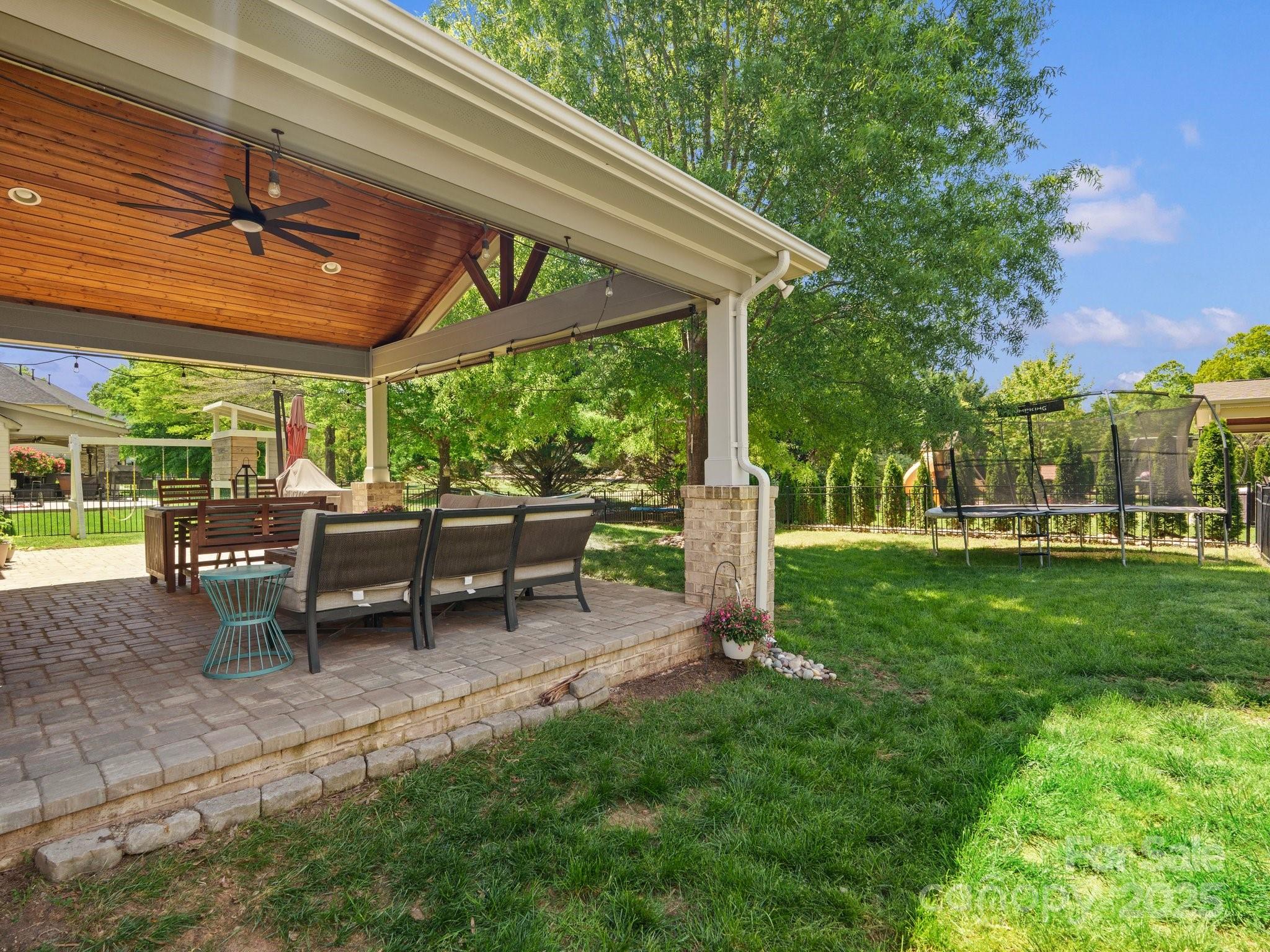 2002 Potomac Road Indian Trail, NC 28079 - Photo 38 of 43 a view of a patio with table and chairs under an umbrella