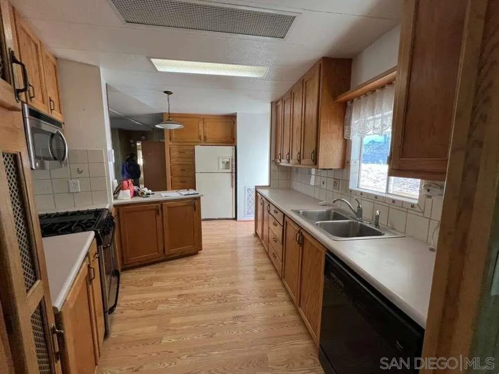 101 Jones Street Bodfish, CA 93205 - Photo 4 of 16 a kitchen with a sink stove and cabinets