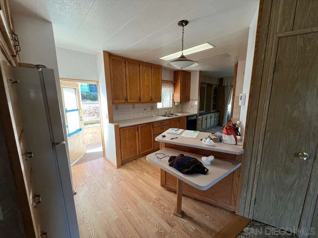 101 Jones Street Bodfish, CA 93205 - Photo 5 of 16 a kitchen with stainless steel appliances a sink stove and refrigerator