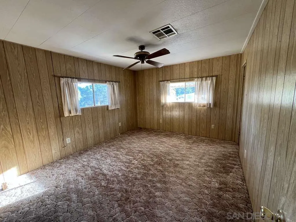 101 Jones Street Bodfish, CA 93205 - Photo 6 of 16 an empty room with windows and fan