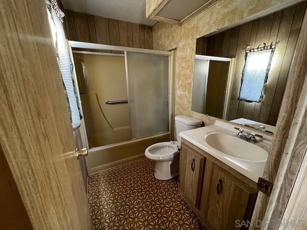 101 Jones Street Bodfish, CA 93205 - Photo 9 of 16 a bathroom with a granite countertop sink toilet and shower