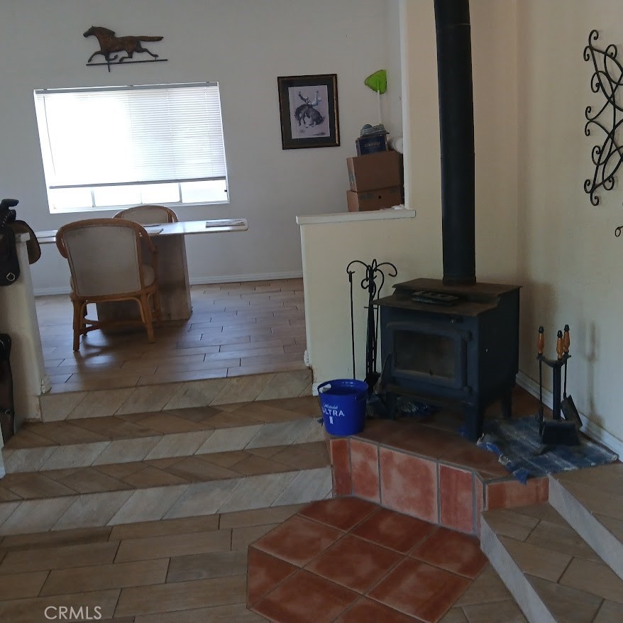 4926 Hedrick Avenue Riverside, CA 92505 - Photo 5 of 10 a living room with furniture a fireplace and window