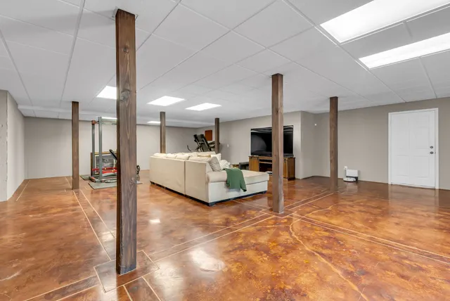 a view of a chairs and table on the balcony