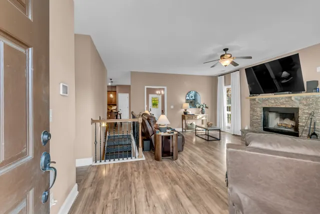 a living room with furniture and a fireplace