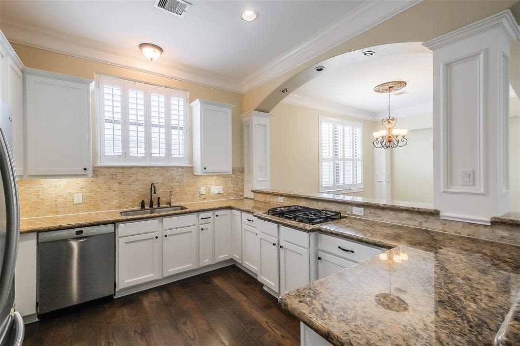 706 Allston Street, Unit B Houston, TX 77007 - Photo 2 of 33 a kitchen with stainless steel appliances granite countertop a sink stove and cabinets