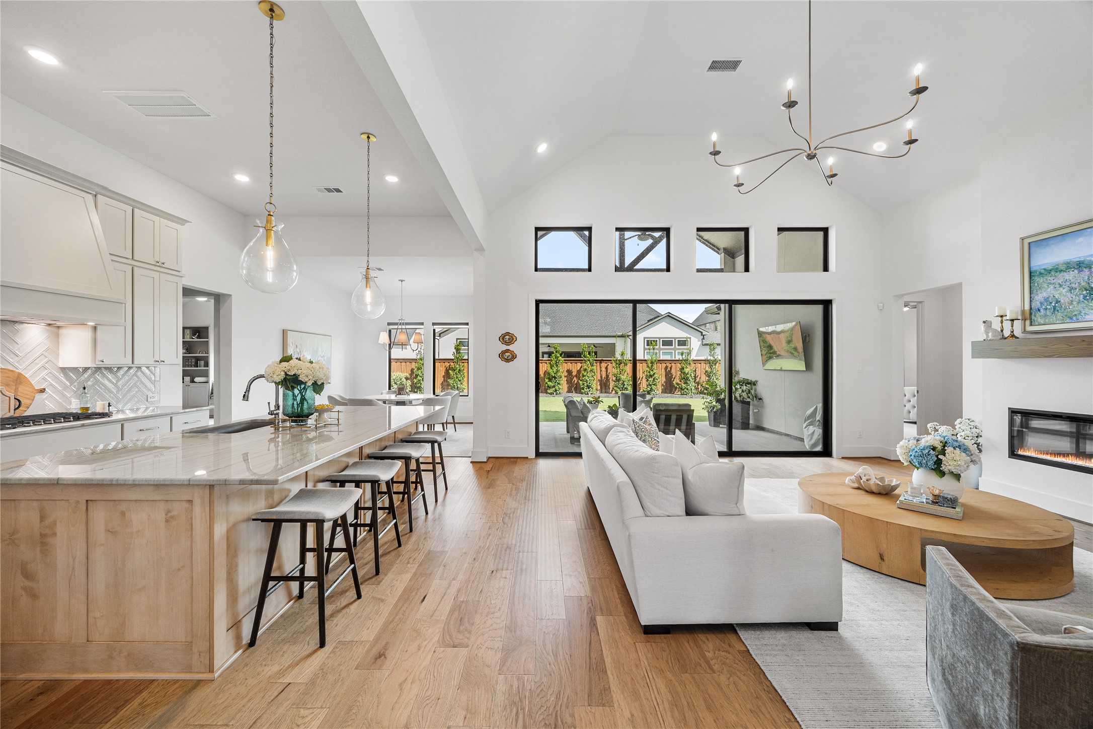 4229 Hollow Wind Way Spring, TX 77386 - Photo 5 of 49 Gathering spaces connected by soaring ceilings and natural light.