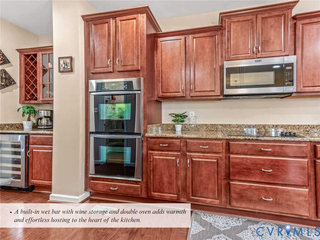 4101 Water Overlook Boulevard Midlothian, VA 23112 - Photo 11 of 50 a kitchen with granite countertop wooden cabinets and a stove top oven
