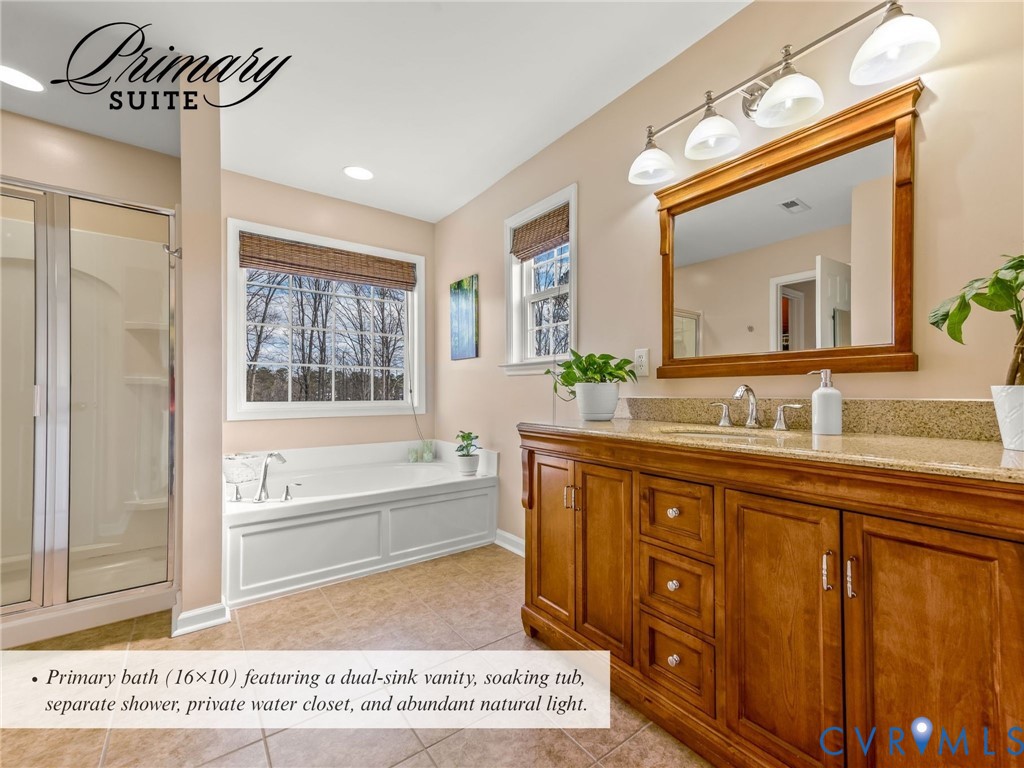 4101 Water Overlook Boulevard Midlothian, VA 23112 - Photo 24 of 50 a spacious bathroom with a granite countertop sink a mirror and a bathtub