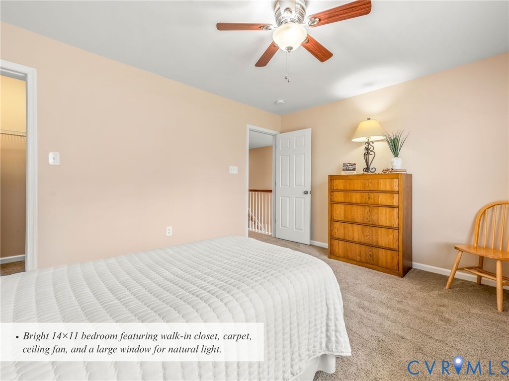 4101 Water Overlook Boulevard Midlothian, VA 23112 - Photo 33 of 50 a bedroom with a bed and a chandelier