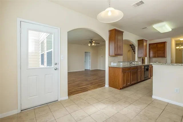 a large bathroom with a large tub and sink