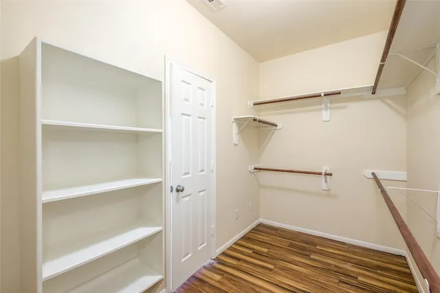a view of an empty walk in closet