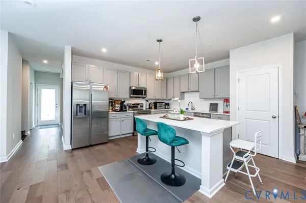 a view of a balcony with wooden floor and fence