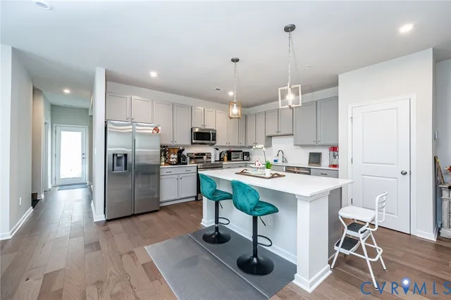 a bed room with a bed and a chair