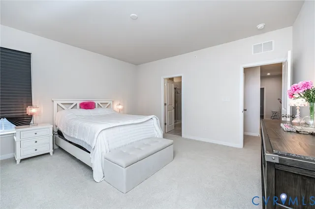 a bedroom with a bed and a table