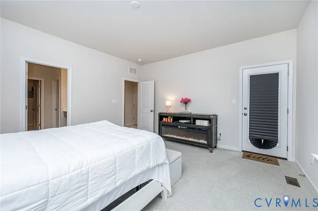 a bedroom with a bed and closet