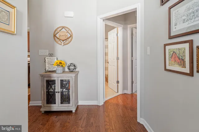 a living room with furniture a rug and a window