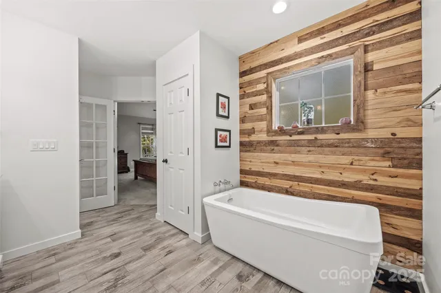 a bathroom with a bathtub and a shower