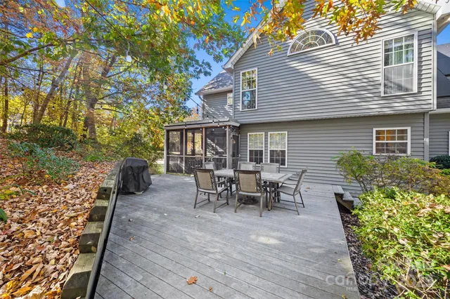 a view of a house with patio and a yard