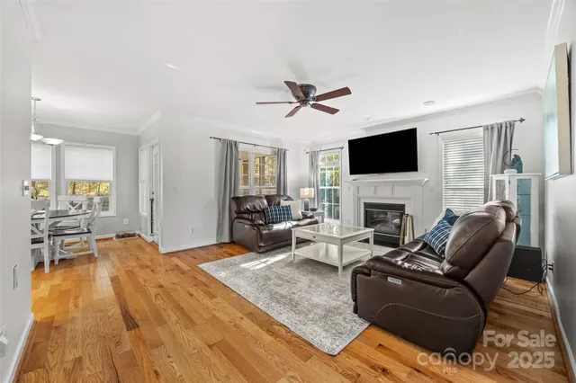 a living room with furniture fireplace and a flat screen tv