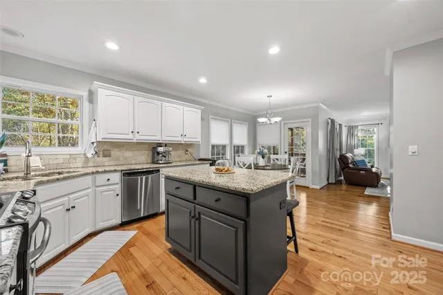 a kitchen with sink and cabinets