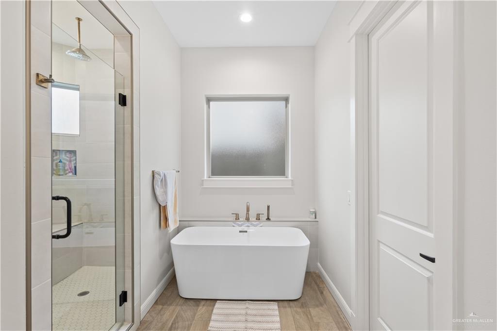 2504 Tulip Street Mission, TX 78574 - Photo 13 of 26 a bathroom with a bathtub and shower