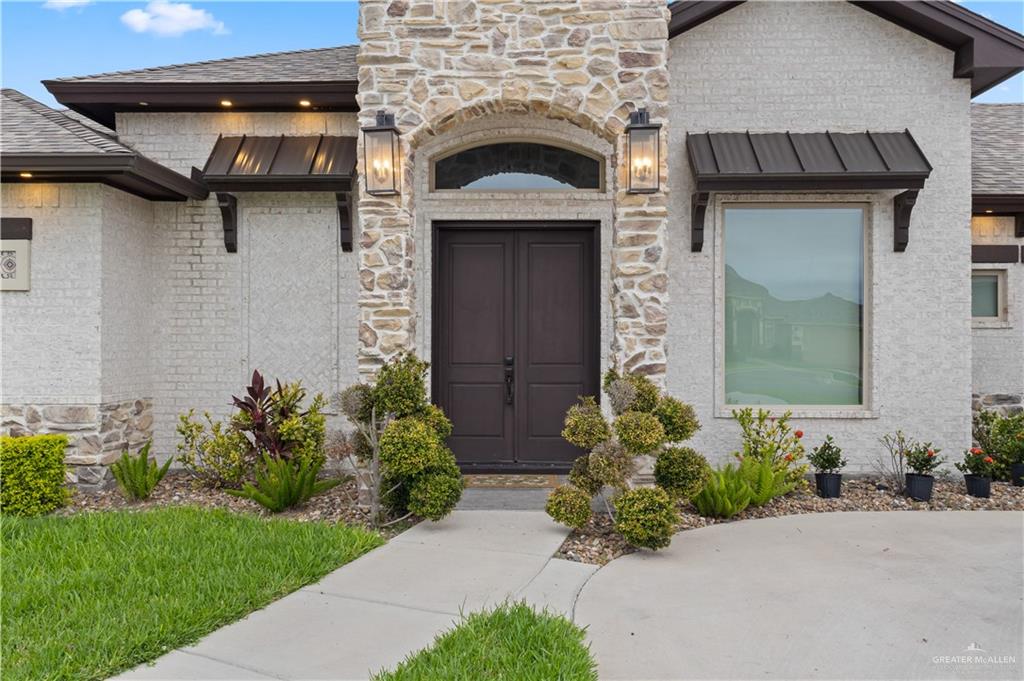 2504 Tulip Street Mission, TX 78574 - Photo 2 of 26 a front view of a house with a garden