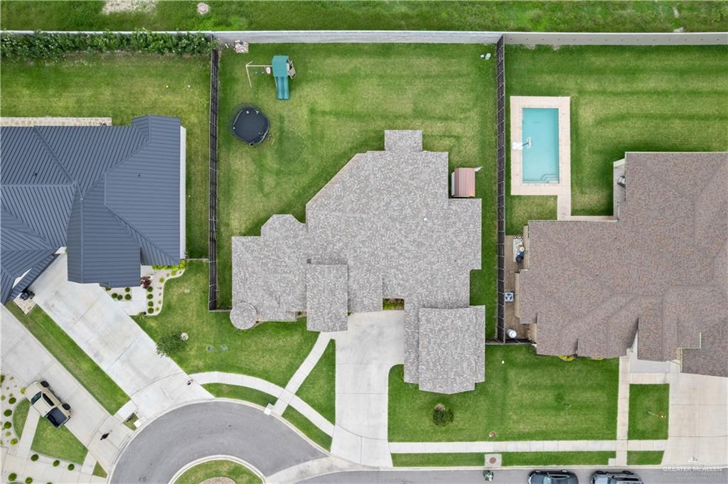 2504 Tulip Street Mission, TX 78574 - Photo 25 of 26 an aerial view of a house with a garden and lake view