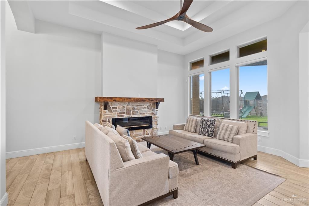 2504 Tulip Street Mission, TX 78574 - Photo 6 of 26 a living room with furniture and a fireplace