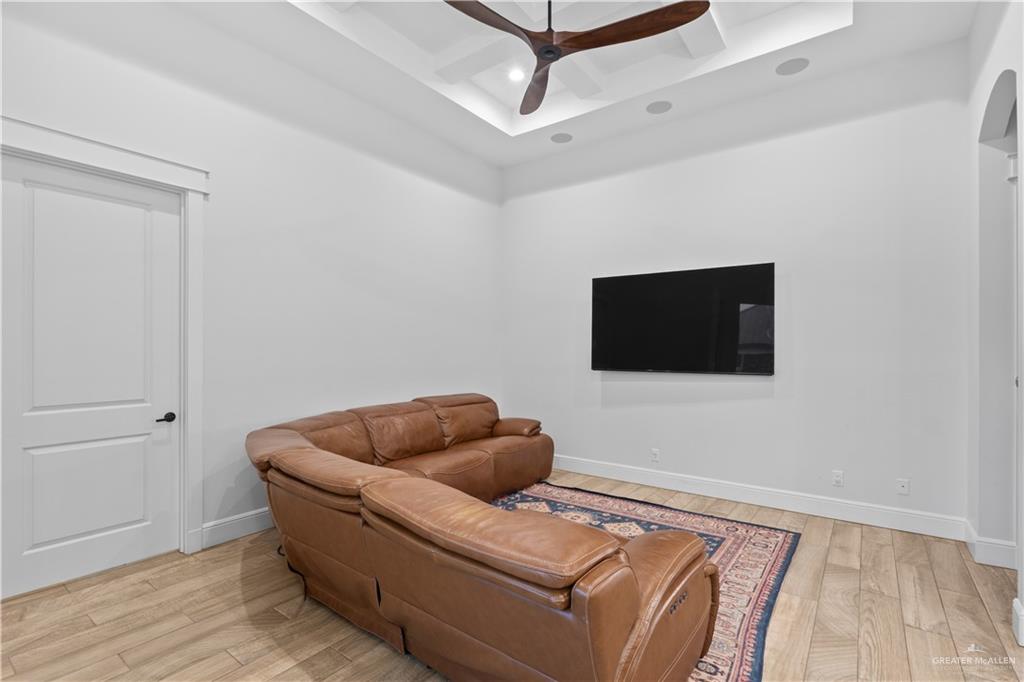 2504 Tulip Street Mission, TX 78574 - Photo 10 of 26 a living room with furniture and a flat screen tv